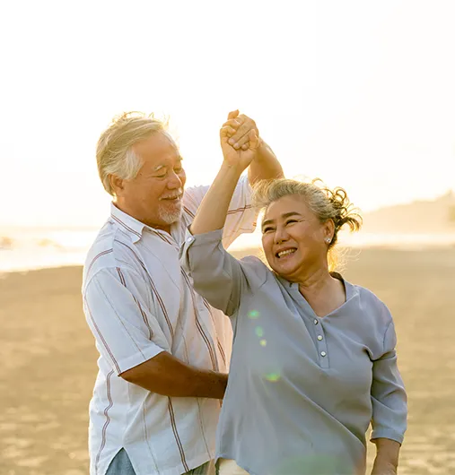 happy couple dancing on the beach risk management